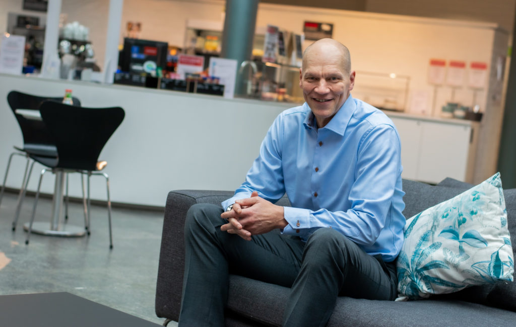 man in business wear sitting on a couch